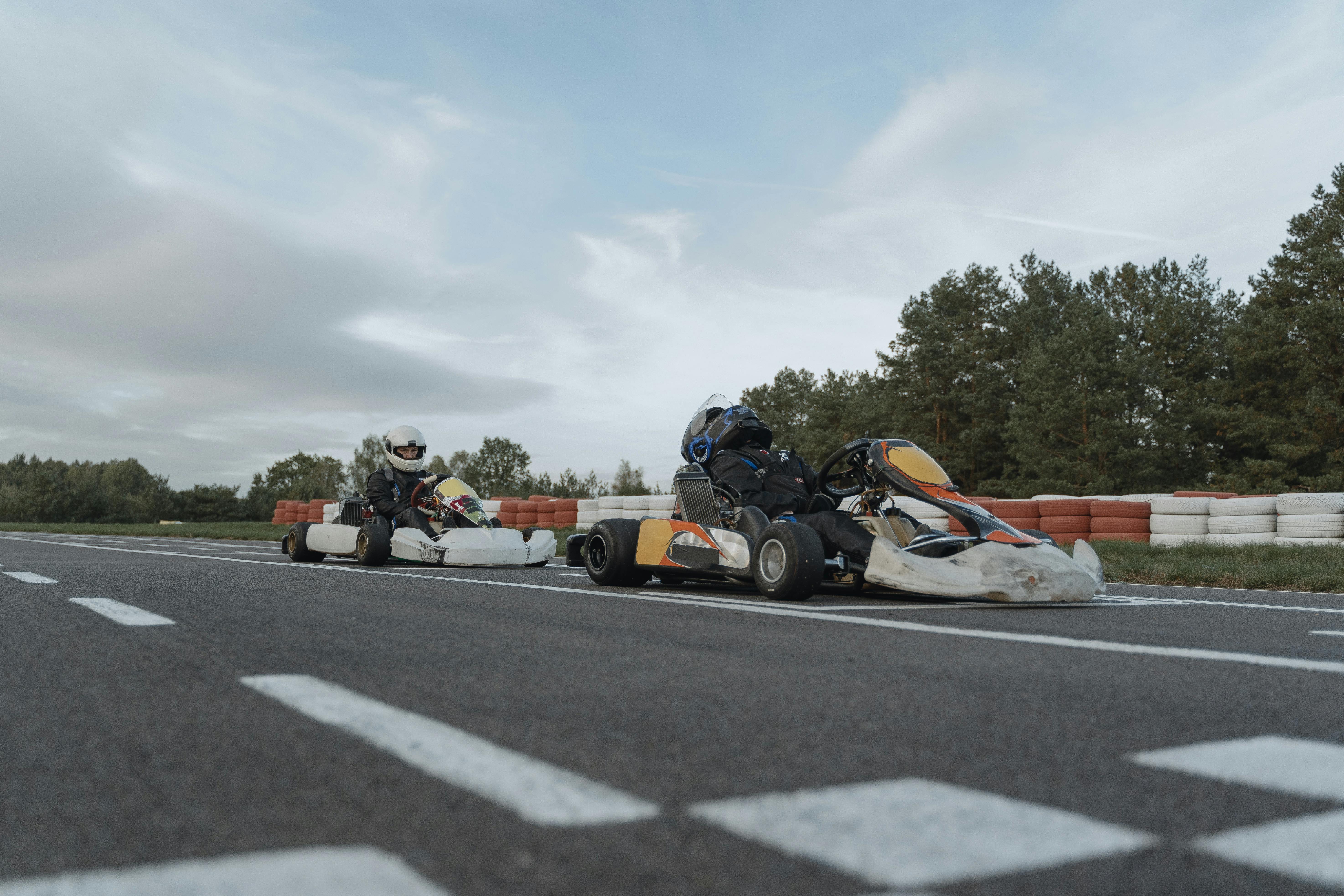 Two people go-karting.